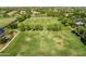 Aerial view of a large soccer field with goals and green grass, surrounded by trees and suburban homes at 4630 E Carriage Ct, Gilbert, AZ 85297