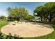 Community splash pad with colorful water features and landscaping, providing a fun and refreshing activity at 4630 E Carriage Ct, Gilbert, AZ 85297