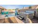 Relaxing backyard with a pool, hot tub, a patio with outdoor seating, and desert landscaping at 4637 E Fernwood Ct, Cave Creek, AZ 85331