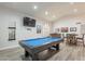 Large game room featuring a pool table, seating, and a TV for entertaining at 4637 E Fernwood Ct, Cave Creek, AZ 85331