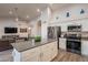 Open kitchen design with a large island, stainless steel appliances, and sleek countertops at 4637 E Fernwood Ct, Cave Creek, AZ 85331