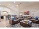 Open-concept living room with vaulted ceilings, a ceiling fan, and comfortable leather seating at 4637 E Fernwood Ct, Cave Creek, AZ 85331