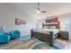 Spacious main bedroom with ceiling fan, an end table, and natural light at 4637 E Fernwood Ct, Cave Creek, AZ 85331