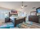Spacious main bedroom with king bed, ceiling fan, and ensuite bathroom access at 4637 E Fernwood Ct, Cave Creek, AZ 85331