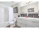 Bathroom features a double sink vanity, tile backsplash, and a shower/tub combination at 4709 N 77Th Pl, Scottsdale, AZ 85251