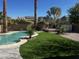 This backyard features a pool, hot tub, manicured lawn, desert landscaping, and a storage shed at 4791 S White Pl, Chandler, AZ 85249