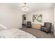 Bedroom featuring neutral decor, stylish chandelier, accent chairs and tranquil ambiance at 4791 S White Pl, Chandler, AZ 85249