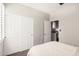 Bedroom with neutral decor, double closets, and modern ceiling fan at 4791 S White Pl, Chandler, AZ 85249