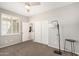 This bedroom features a ceiling fan, a window with shutters, and a closet with sliding doors at 4791 S White Pl, Chandler, AZ 85249