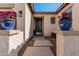Inviting front entrance with decorative planters and a stepping stone pathway at 4791 S White Pl, Chandler, AZ 85249