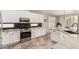 Modern kitchen with white cabinetry and a stainless steel oven range at 4791 S White Pl, Chandler, AZ 85249
