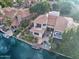 Beautiful home featuring a private pool, spa, outdoor living spaces, and waterfront access with a boat dock at 517 S Marina Dr, Gilbert, AZ 85233