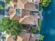 Birds eye view of home with a pool, spa, outdoor living room, and boat dock on the water at 517 S Marina Dr, Gilbert, AZ 85233
