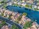 Stunning aerial view of waterfront homes, showcasing beautiful landscaping and a serene lake at 517 S Marina Dr, Gilbert, AZ 85233