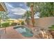 Backyard pool with tropical landscaping and lake view offering a resort-like atmosphere at 517 S Marina Dr, Gilbert, AZ 85233