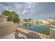 Balcony with stunning views of the water and neighboring homes, providing a serene outdoor living space at 517 S Marina Dr, Gilbert, AZ 85233