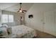 Vaulted-ceiling bedroom offering a ceiling fan and mounted television by a sunny window at 517 S Marina Dr, Gilbert, AZ 85233
