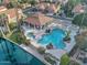 Community pool and hot tub with shaded lounging area by the lake at 517 S Marina Dr, Gilbert, AZ 85233