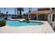 Community pool area with pergola and plenty of seating next to the lake at 517 S Marina Dr, Gilbert, AZ 85233