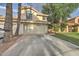 Inviting two-story home with a well-maintained front yard and a two-car garage at 517 S Marina Dr, Gilbert, AZ 85233