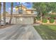 Inviting two-story home with a well-maintained front yard and a two-car garage at 517 S Marina Dr, Gilbert, AZ 85233