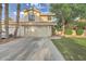 Charming two-story home featuring a tile roof, well-maintained lawn, mature trees, and a spacious driveway at 517 S Marina Dr, Gilbert, AZ 85233