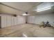 Spacious garage with ample storage cabinets and room for vehicles at 517 S Marina Dr, Gilbert, AZ 85233