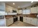 Well-lit kitchen with white cabinetry, stainless steel appliances, and neutral countertops at 517 S Marina Dr, Gilbert, AZ 85233