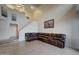 Spacious living room featuring high ceilings and a cozy leather sectional sofa at 517 S Marina Dr, Gilbert, AZ 85233