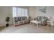 Comfortable living room with sofas, light-colored walls, and tile flooring at 517 S Marina Dr, Gilbert, AZ 85233