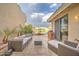 Inviting outdoor patio with comfortable seating, a grill, and lake views for relaxing and entertaining at 517 S Marina Dr, Gilbert, AZ 85233