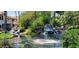 Enjoy this outdoor water feature with waterfalls and lush landscaping at 517 S Marina Dr, Gilbert, AZ 85233