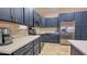 This kitchen offers stainless steel appliances, modern countertops, and ample cabinet space, catering to culinary enthusiasts at 522 S 122Nd Ln, Avondale, AZ 85323