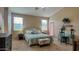 This primary bedroom features a king bed, neutral walls, and a sitting area, creating a cozy retreat at 522 S 122Nd Ln, Avondale, AZ 85323