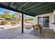 Spacious covered backyard patio with table and seating for outdoor enjoyment, near pool access at 5532 W Onyx Ave, Glendale, AZ 85302