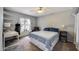 Comfortable bedroom featuring a ceiling fan, carpet flooring, and natural light from the window at 5532 W Onyx Ave, Glendale, AZ 85302