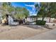 Quaint single-story home boasting a gravel front yard and mature trees for added curb appeal at 5532 W Onyx Ave, Glendale, AZ 85302