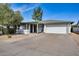 Single-story home featuring a well-maintained front yard, covered porch, and a two-car garage at 5532 W Onyx Ave, Glendale, AZ 85302