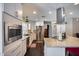 Modern kitchen featuring stainless steel appliances, granite countertops, and white cabinetry at 5532 W Onyx Ave, Glendale, AZ 85302