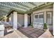 Covered porch with decorative columns and brick accents leading to the front door and window at 5532 W Onyx Ave, Glendale, AZ 85302