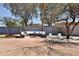 Backyard featuring a conversation area with a built in bench, fire pit, and additional outdoor seating at 6071 E Ludlow Dr, Scottsdale, AZ 85254