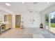 Bright bathroom featuring a large walk-in shower, double vanity, and backyard access at 6071 E Ludlow Dr, Scottsdale, AZ 85254