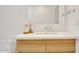 Bright bathroom showcasing a white vanity with a modern sink and wood cabinets at 6071 E Ludlow Dr, Scottsdale, AZ 85254