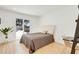 Cozy bedroom with light wood floors, a sliding glass door, and a view of the pool at 6071 E Ludlow Dr, Scottsdale, AZ 85254
