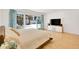 Bright bedroom featuring a sliding door to the backyard and a mounted television at 6071 E Ludlow Dr, Scottsdale, AZ 85254