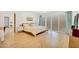 This bedroom features tile floors, sliding glass doors, and a large bed at 6071 E Ludlow Dr, Scottsdale, AZ 85254