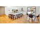 A modern kitchen with a large central island with seating and an adjacent breakfast nook at 6071 E Ludlow Dr, Scottsdale, AZ 85254