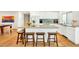 A modern kitchen showcasing a spacious island with barstool seating and open access to the dining room at 6071 E Ludlow Dr, Scottsdale, AZ 85254