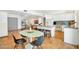 Spacious eat-in kitchen features white cabinets, an island with seating, and bright natural light at 6071 E Ludlow Dr, Scottsdale, AZ 85254