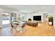 Bright open living room with direct access to outdoor living spaces and a view of the pool at 6071 E Ludlow Dr, Scottsdale, AZ 85254
